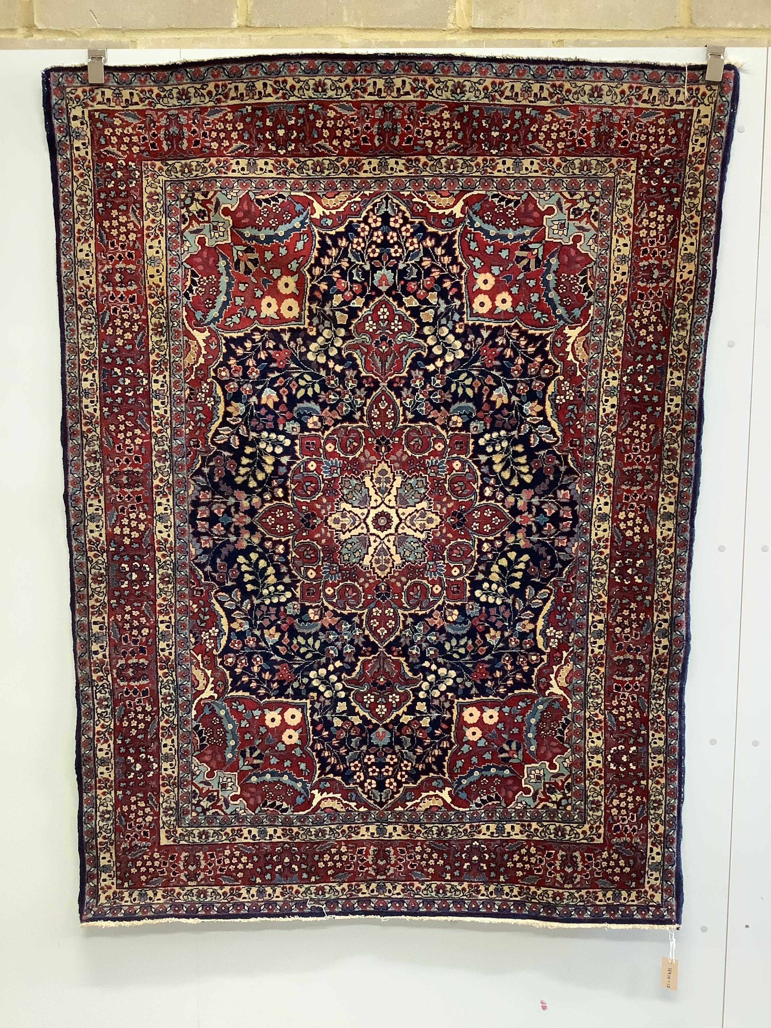 A Sarouk Feraghan Persian blue ground rug, 186 x 137cm. Condition - good